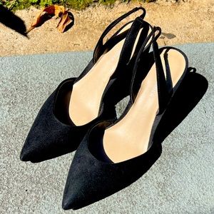Marc Jacobs black sling back point toe shoes.